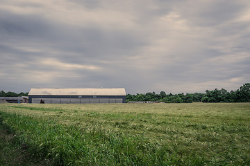 Image showing Barn on a field in cloudy weather