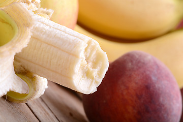 Image showing fruits on table, apple, bananas, peach close up, health food concept