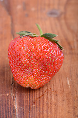 Image showing Strawberry on wooden plate close up