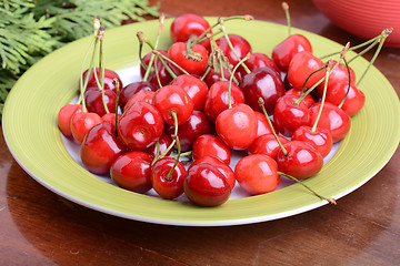 Image showing Cherries on green table close up 