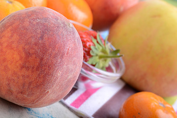 Image showing many different fruits for the health of the entire family, peach, mandarin, orange, banana