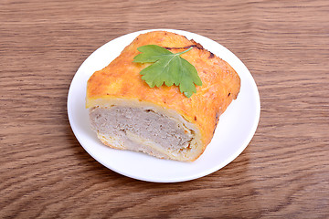 Image showing fresh beef meat fillet with raw kale leafs on white plate