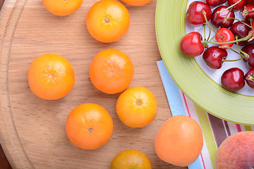 Image showing mandarin, peach and cherry fresh fruits and berries, summer health food