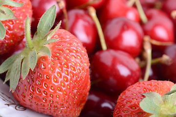 Image showing Sweet cherries and strawberries close up
