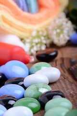 Image showing Spa still life with aromatic candles, stones, flower and towel, close up