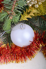 Image showing Christmas baubles on christmas tree. new year invitation card