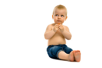 Image showing baby sitting on a white floor