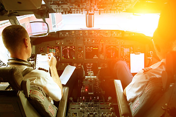 Image showing Pilots Working in an Aircraft 