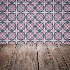 Image showing Wood table top and blur vintage ceramic tile pattern wall