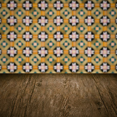 Image showing Wood table top and blur vintage ceramic tile pattern wall