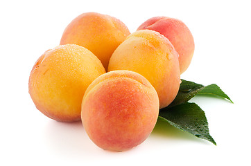 Image showing Sweet peaches with leafs