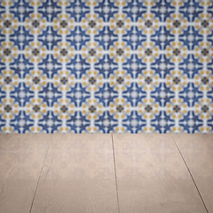 Image showing Wood table top and blur vintage ceramic tile pattern wall