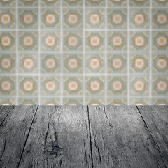 Image showing Wood table top and blur vintage ceramic tile pattern wall