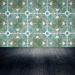 Image showing Wood table top and blur vintage ceramic tile pattern wall