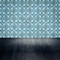 Image showing Wood table top and blur vintage ceramic tile pattern wall