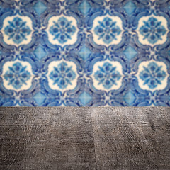 Image showing Wood table top and blur vintage ceramic tile pattern wall