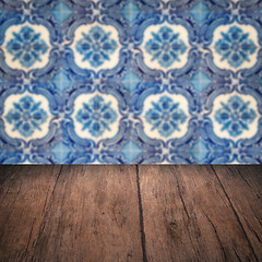 Image showing Wood table top and blur vintage ceramic tile pattern wall