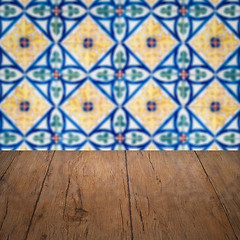 Image showing Wood table top and blur vintage ceramic tile pattern wall