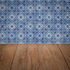 Image showing Wood table top and blur vintage ceramic tile pattern wall