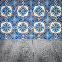 Image showing Wood table top and blur vintage ceramic tile pattern wall