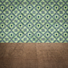 Image showing Wood table top and blur vintage ceramic tile pattern wall