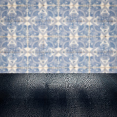 Image showing Wood table top and blur vintage ceramic tile pattern wall