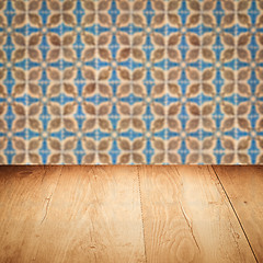 Image showing Wood table top and blur vintage ceramic tile pattern wall