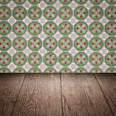 Image showing Wood table top and blur vintage ceramic tile pattern wall