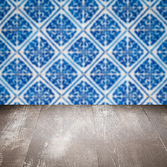 Image showing Wood table top and blur vintage ceramic tile pattern wall