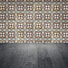 Image showing Wood table top and blur vintage ceramic tile pattern wall