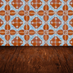 Image showing Wood table top and blur vintage ceramic tile pattern wall