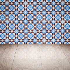 Image showing Wood table top and blur vintage ceramic tile pattern wall