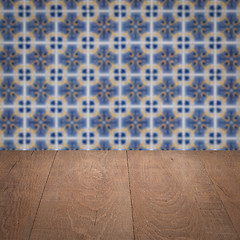 Image showing Wood table top and blur vintage ceramic tile pattern wall