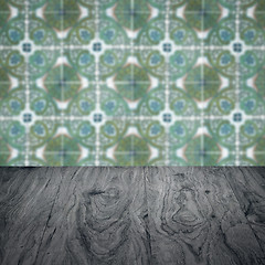 Image showing Wood table top and blur vintage ceramic tile pattern wall