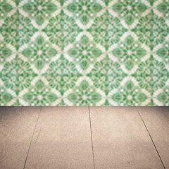 Image showing Wood table top and blur vintage ceramic tile pattern wall