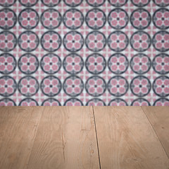 Image showing Wood table top and blur vintage ceramic tile pattern wall