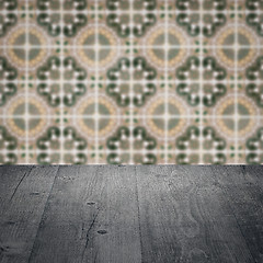 Image showing Wood table top and blur vintage ceramic tile pattern wall