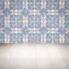 Image showing Wood table top and blur vintage ceramic tile pattern wall