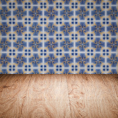 Image showing Wood table top and blur vintage ceramic tile pattern wall