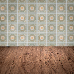 Image showing Wood table top and blur vintage ceramic tile pattern wall