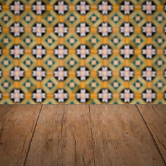 Image showing Wood table top and blur vintage ceramic tile pattern wall