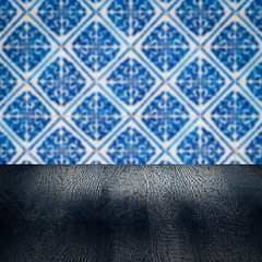 Image showing Wood table top and blur vintage ceramic tile pattern wall