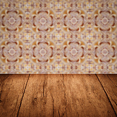 Image showing Wood table top and blur vintage ceramic tile pattern wall