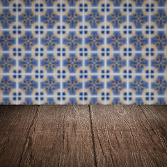 Image showing Wood table top and blur vintage ceramic tile pattern wall