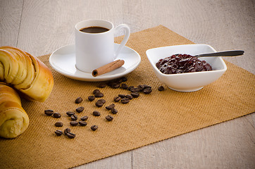 Image showing Cup of black coffee and croissant 