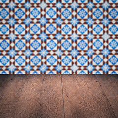 Image showing Wood table top and blur vintage ceramic tile pattern wall