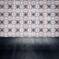 Image showing Wood table top and blur vintage ceramic tile pattern wall