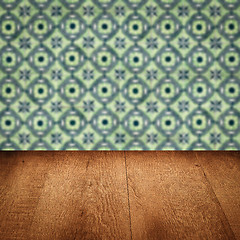 Image showing Wood table top and blur vintage ceramic tile pattern wall