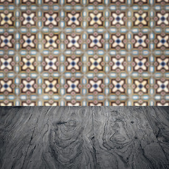 Image showing Wood table top and blur vintage ceramic tile pattern wall