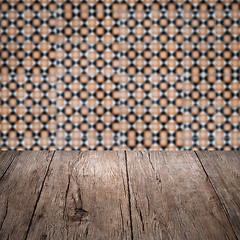 Image showing Wood table top and blur vintage ceramic tile pattern wall